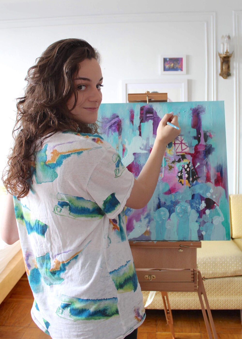 Evangeline Stott painting in her studio.